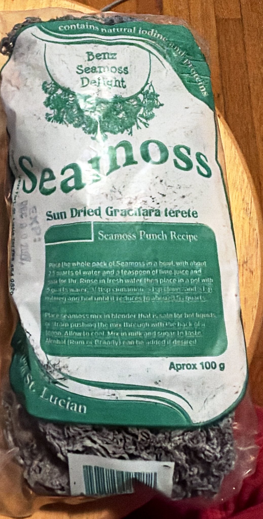 Green-label bag of sun-dried Saint Lucian sea moss: Sun Dried Gracilaria terete, approx 100 g, 100% St. Lucian, with a seamoss punch recipe printed on the label.