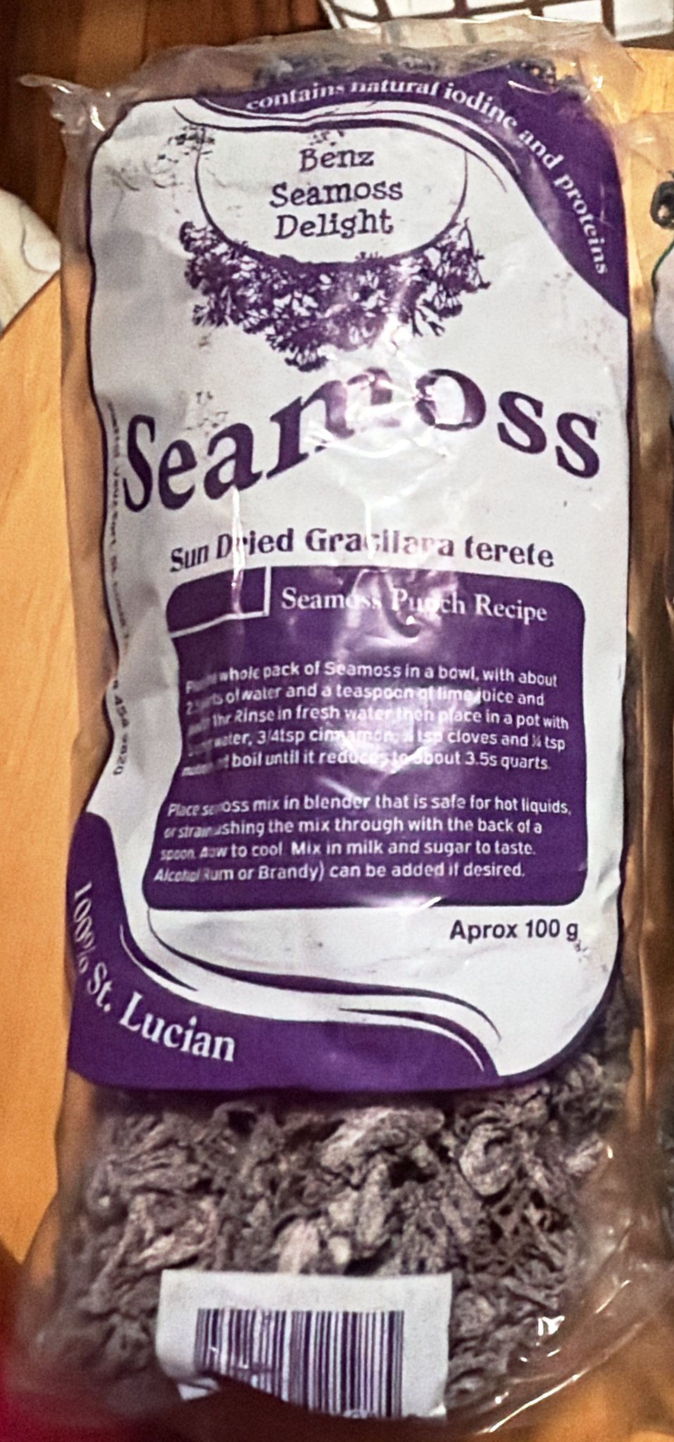 Purple-label bag of sun-dried Saint Lucian sea moss: Sun Dried Gracilaria terete, approx 100 g, 100% St. Lucian, with a seamoss punch recipe printed on the label.